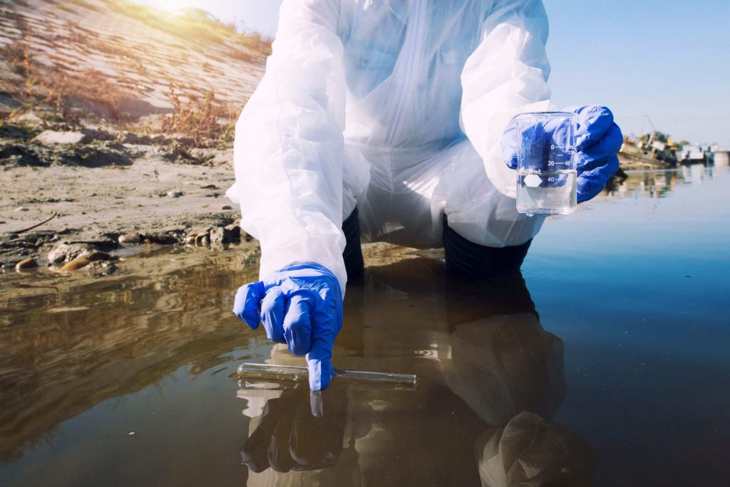 ecologist taking samples water with test tube from city river determine level contamination pollution 1 scaled 1